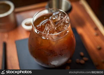 iced black coffee  iced americano  on the wooden table. . iced black coffee  iced americano 