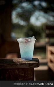 Iced blue hawaii soda on table . Iced blue hawaii soda