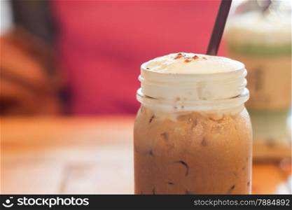 Iced caffe mocha with milk foam, stock photo