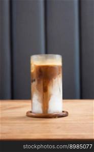 Iced coffee latte on wooden table, stock photo