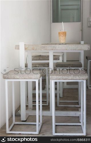Iced coffee on concrete table top, stock photo