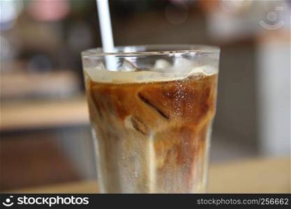 Iced coffee on wood background