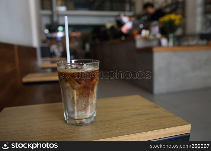 Iced coffee on wood background