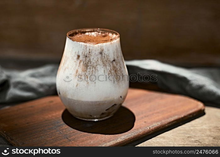 Iced coffee vanilla latte with milk foam.selective focus. Iced coffee vanilla latte with milk foam.