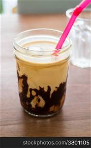 Iced coffee with chocolate sauce, stock photo