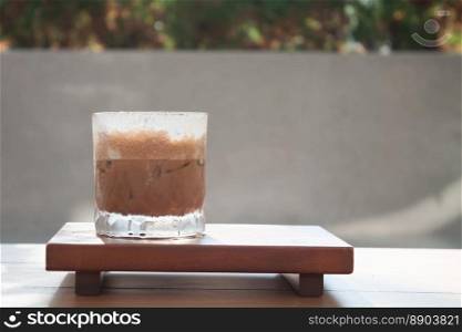 Iced coffee with micro foam in coffee shop, stock photo