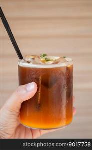 Iced coffee with orange in coffee shop, stock photo