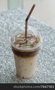 Iced coffee with straw. Iced coffee with straw in plastic cup for take aways