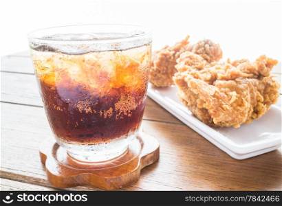 Iced cola drink and fried chicken, stock photo