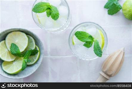 Iced cold lemonade with fresh lime and juice.  Summer drink in glass 