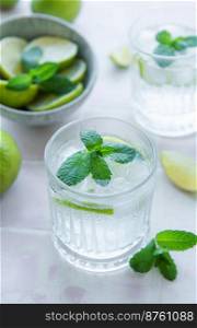 Iced cold lemonade with fresh lime and juice.  Summer drink in glass 