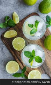 Iced cold lemonade with fresh lime and juice.  Summer drink in glasses