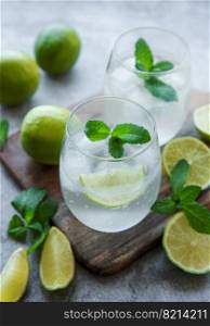 Iced cold lemonade with fresh lime and juice.  Summer drink in glasses