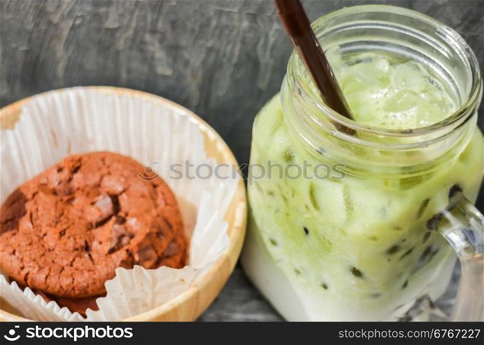 Iced green tea latte and chocolate cookies, stock photo