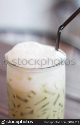 Iced green tea with microfoam, stock photo