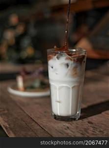 iced latte coffee in a glass with cold milk. . iced latte coffee