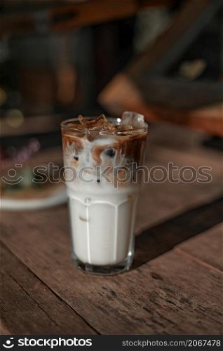iced latte coffee in a glass with cold milk. . iced latte coffee