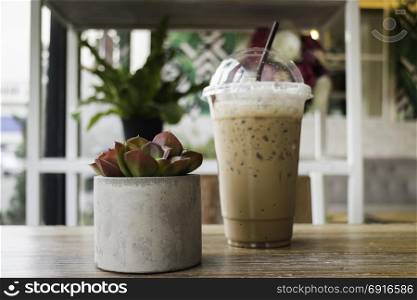 Iced mocha coffee on wooden table, stock photo