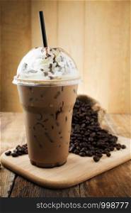 iced mocha with straw in plastic cup
