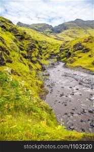 Iceland Landscape. River and mountains in summer season.