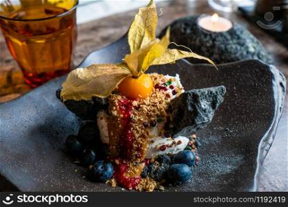 Icelandic ice cream menu with volcanic rock sugar cane and blueberries.