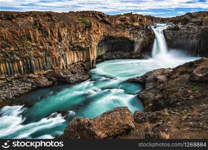 Icelandic summer landscape of the Aldeyjarfoss waterfall in north Iceland. The waterfall is situated in the northern part of the Sprengisandur Road within the Highlands of Iceland.