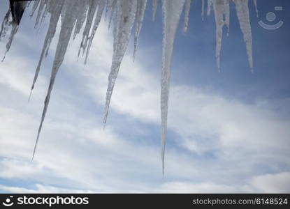 Icicles against cloudy sky, Kicking Horse Mountain Resort, Golden, British Columbia, Canada