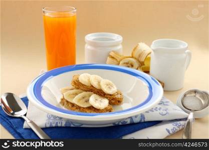 Iconic Australian breakfast cereal Weet Bix served with juice and banana.