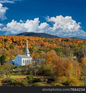 Iconic New England church in Stowe town at autumn in Vermont, USA 