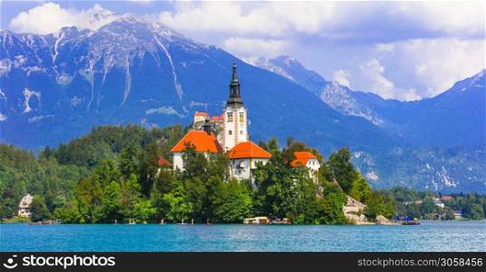 Iconic view of stunning lake Bled with small island and the church. Nature of Slovenia
