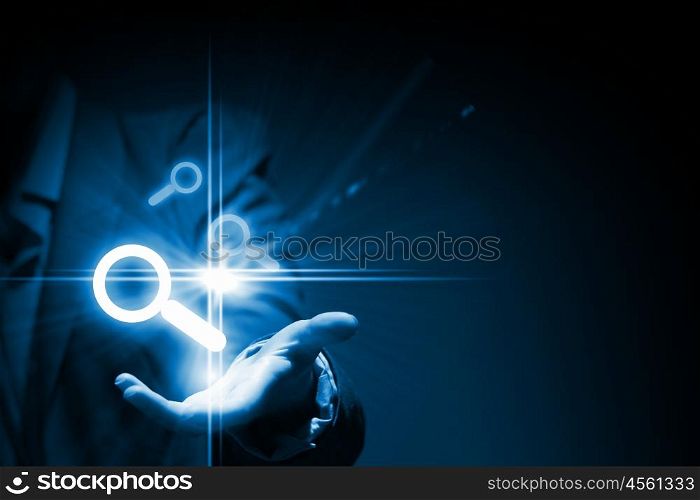 Icons in hand. Close up of businessman hand holding digital icons