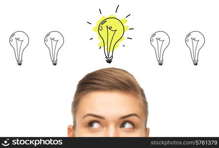 idea, business, education and people concept - close up of beautiful female eyes looking up to lighting bulb doodles