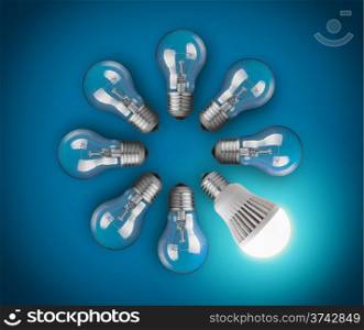 Idea concept with circle of light bulbs and glowing LED bulb