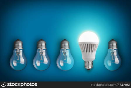 Idea concept with row of light bulbs and glowing LED bulb