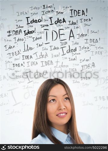 Idea concept. Young business woman with idea signs in front
