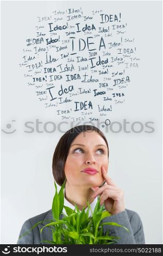 Idea concept. Young business woman with idea signs overhead