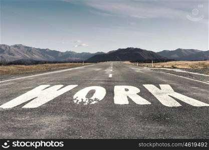 Idea for new direction. Conceptual image of asphalt road with word idea drawn with paint