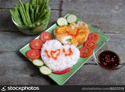Idea for Valentine day meal, cooked rice, omelet in heart shape, tomato, cucumber,bean for nutrition eating, simple, cheap and quick food, love you message, meaningful in love day with Vietnamese food