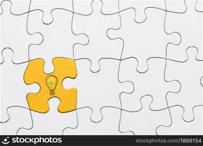 idea icon yellow puzzle piece connected with white grid puzzle backdrop. Resolution and high quality beautiful photo. idea icon yellow puzzle piece connected with white grid puzzle backdrop. High quality beautiful photo concept