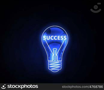 Idea of success. Glowing light bulb on dark background with word inside