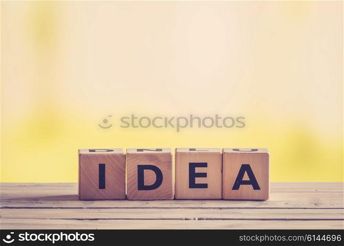 Idea sign made of wooden cubes on a table