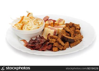 Ideal beer snack dish, dry sausage, crackers, cheese strips and mini-sandwiches
