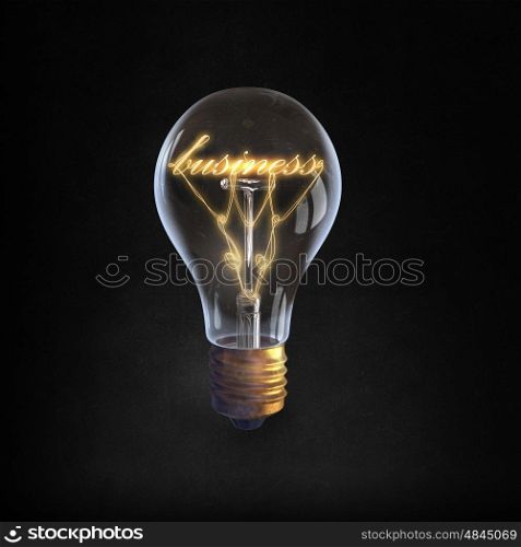 Ideas for business. Glowing glass light bulb with business word inside