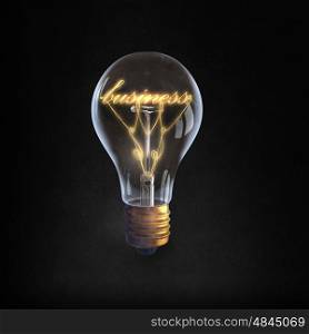 Ideas for business. Glowing glass light bulb with business word inside