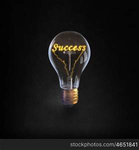 Ideas for business. Glowing glass light bulb with success word inside