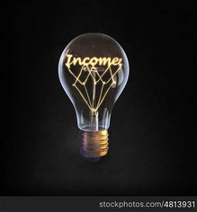 Ideas for business. Glowing glass light bulb with word income inside