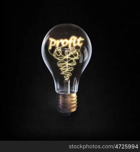 Ideas for business. Glowing glass light bulb with word profit inside
