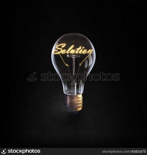 Ideas for business. Glowing glass light bulb with word solution inside