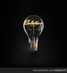 Ideas for business. Glowing glass light bulb with word solution inside