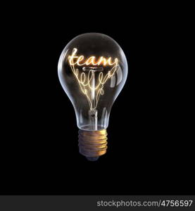 Ideas for business. Glowing glass light bulb with word team inside